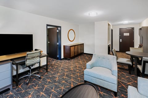 Premium Suite, 1 Bedroom | Desk, blackout drapes, iron/ironing board, free WiFi