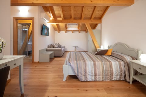 Triple Room | Desk, blackout drapes, soundproofing, free cribs/infant beds