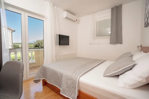 Family Room | Down comforters, minibar, in-room safe, desk