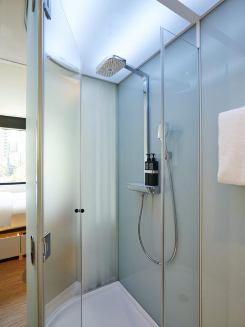 King Room | Bathroom | Shower, hydromassage showerhead, eco-friendly toiletries, hair dryer