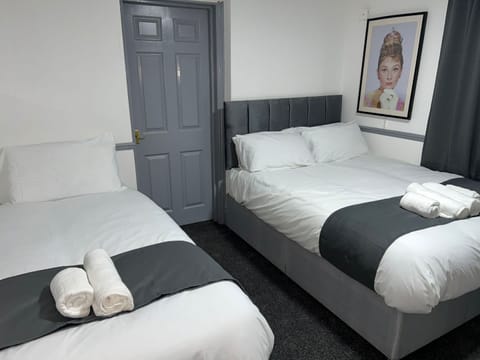 Standard Room, Multiple Beds (Family) | In-room safe, iron/ironing board, free WiFi, bed sheets