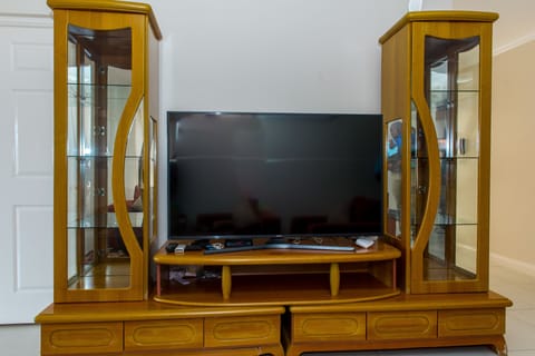 Luxury Apartment, 2 Bedrooms | Living area | 50-inch flat-screen TV with cable channels, TV, DVD player