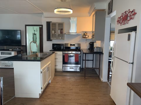 Kitchen-granite counter top, large sink, gas stove