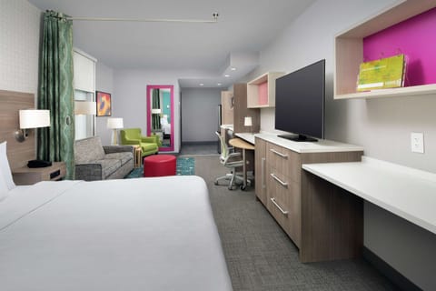 Studio Suite, 1 King Bed, Corner | Desk, laptop workspace, blackout drapes, iron/ironing board