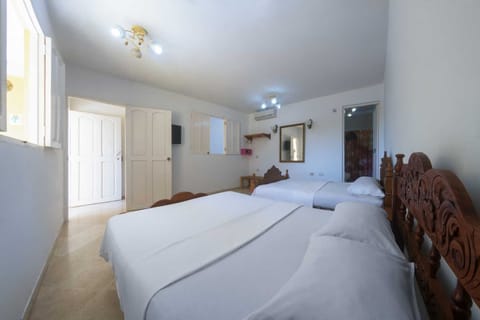 Family Quadruple Room, 2 Double Beds, Non Smoking | Minibar, in-room safe, individually decorated, individually furnished