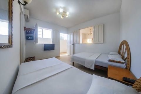 Deluxe Quadruple Room, Multiple Beds, Non Smoking | Minibar, in-room safe, individually decorated, individually furnished
