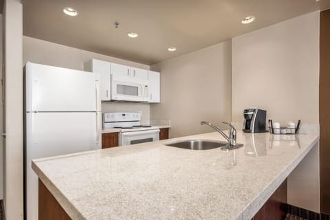 Suite, 1 Bedroom | Private kitchen | Full-size fridge, microwave, stovetop, coffee/tea maker