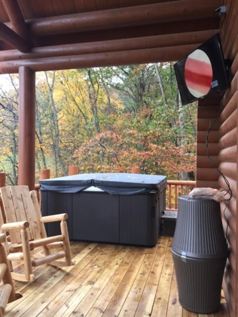 Hot tub, outdoor television, rockers and patio furniture