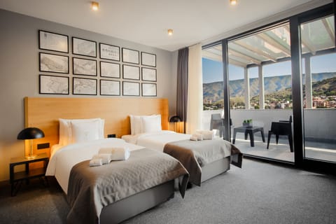Luxury Triple Room, Terrace | Premium bedding, minibar, in-room safe, desk
