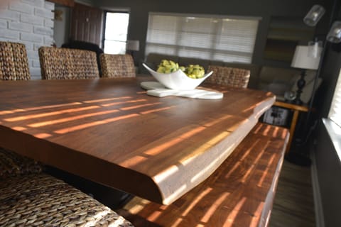 Farmhouse table ready for shared meals.