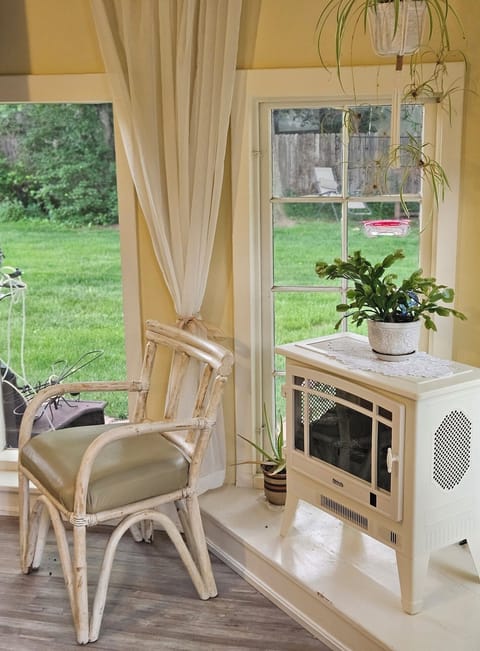 Enjoy the view of my beautiful yard from my sunroom that faces South.