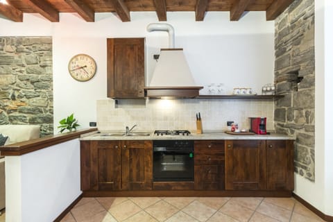 Apartment, 1 Bedroom | Private kitchen | Full-size fridge, stovetop, cookware/dishes/utensils