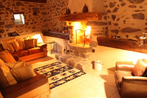 Huge fireplace, with ample cozy seating.