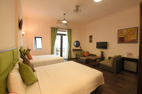 Family Room, 2 Queen Beds | Minibar, in-room safe, desk, free WiFi