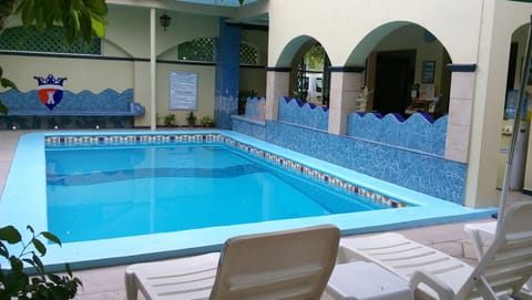 Outdoor pool, open 8 AM to 9 PM, pool umbrellas, sun loungers