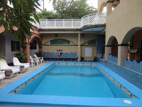 Outdoor pool, open 8 AM to 9 PM, pool umbrellas, sun loungers