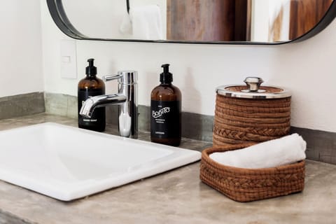 Designer toiletries, hair dryer, towels