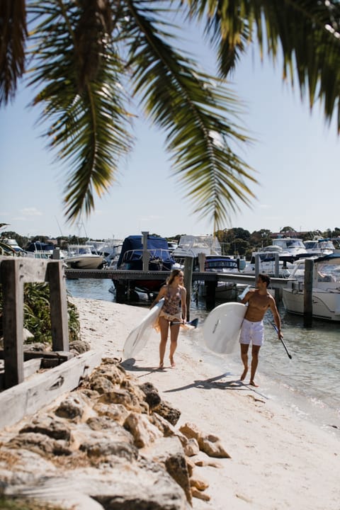 On the beach, white sand, sun loungers, beach umbrellas