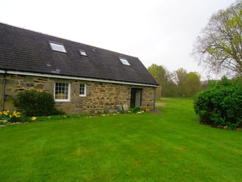 French window from the sitting room opening out on to the Burn an garden area
