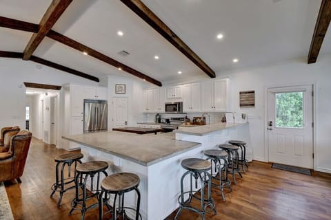 Over-sized kitchen with plenty of bar seating for 6