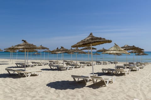 Private beach, white sand, sun loungers, beach umbrellas