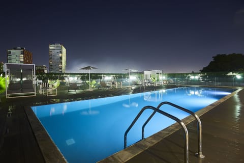 Outdoor pool, open 7 AM to 9 PM, sun loungers