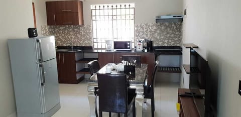 Standard Apartment, 1 King Bed | Private kitchen | Fridge, microwave, stovetop, electric kettle