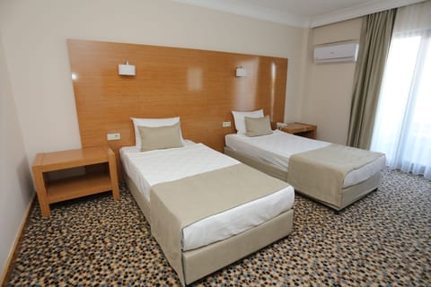 Standard Double or Twin Room, Sea View | Minibar, in-room safe, desk, bed sheets