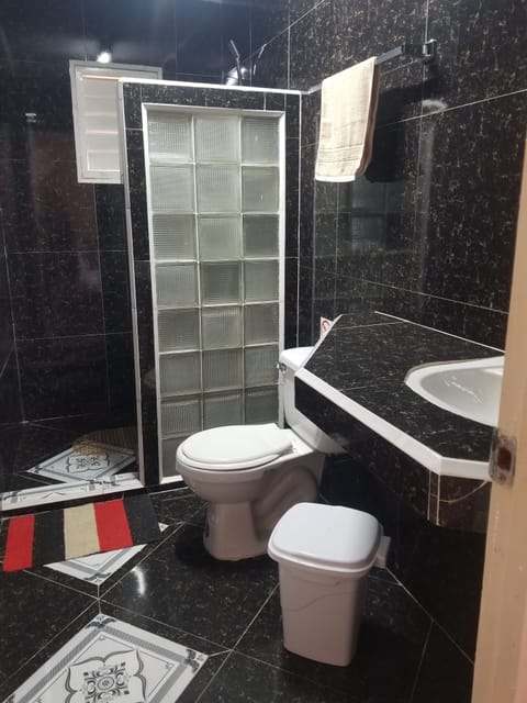 Family Triple Room, 1 Bedroom | Bathroom | Shower, rainfall showerhead, free toiletries, hair dryer