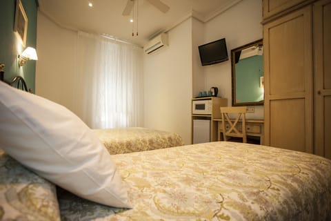 Family Triple Room, 1 double beds and 1 single bed, Private Bathroom | Desk, iron/ironing board, free WiFi, bed sheets