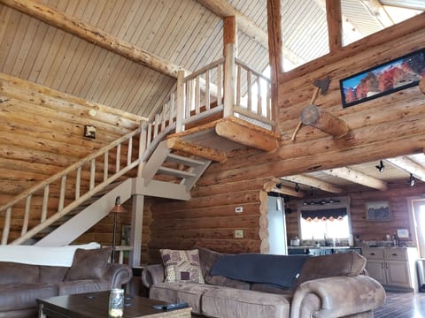 Living room. Stairway to upstairs loft bedroom