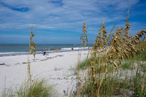 Beach nearby, white sand, beach towels