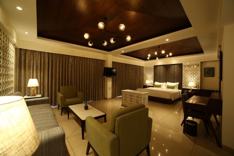 Lagoona suite | Living area | 34-inch TV with satellite channels