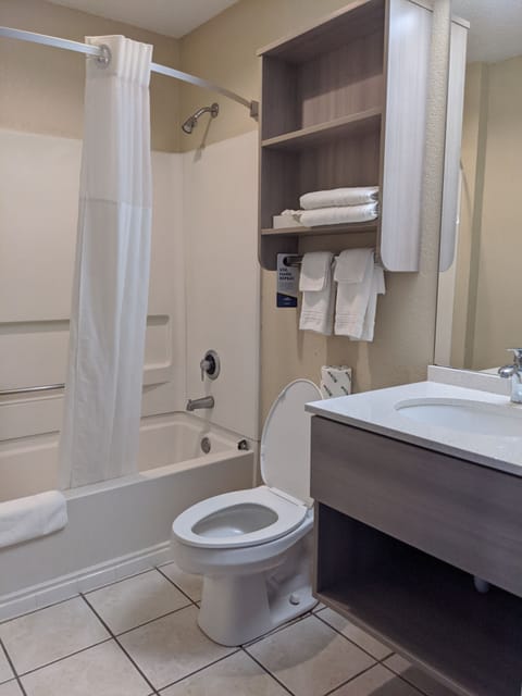Standard Room, 2 Queen Beds | Bathroom | Combined shower/tub, free toiletries, hair dryer, towels