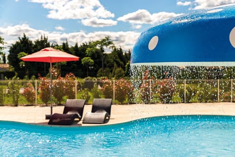 Enjoy relaxing by the outdoor swimming pool.