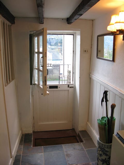 Front stable door leading fkitchen opening onto the patio