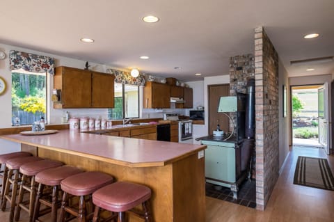 Our large kitchen, bar and my great grandmothers antique stove