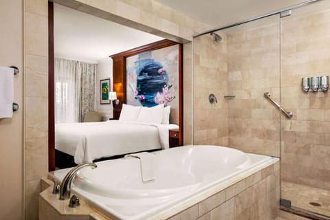 Suite, 1 King Bed, Non Smoking (Hydrotherapy) | Bathroom | Shower, designer toiletries, hair dryer, bathrobes