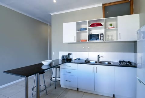 Apartment, 1 Bedroom, Non Smoking, Sea View (1/4) | Private kitchen | Full-size fridge, microwave, stovetop, electric kettle