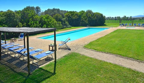 Bamboo shades at both ends of the pool