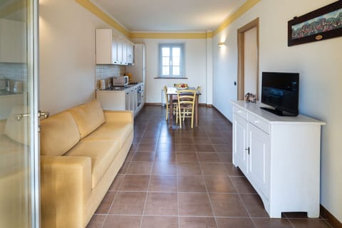 Furniture, Picture Frame, Property, Couch, Interior Design, Flooring, Living Room, Floor, Houseplant, Wall