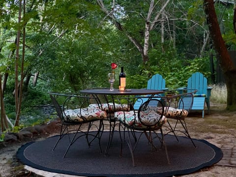 Dine alfresco next to the creek... with your favorite bottle of wine.