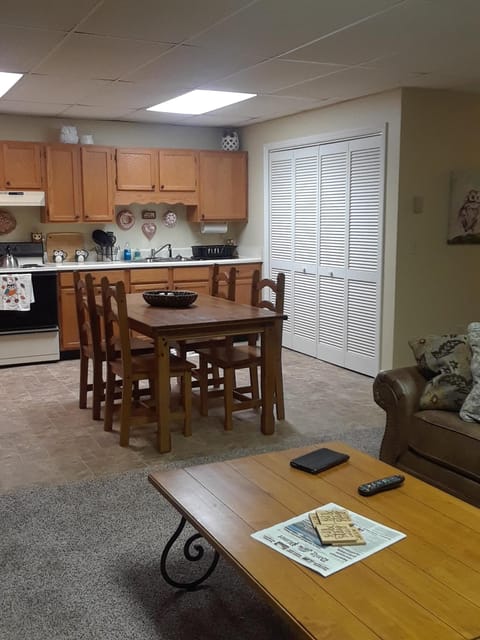 View from living area into kitchen with seating for up to 6 guests