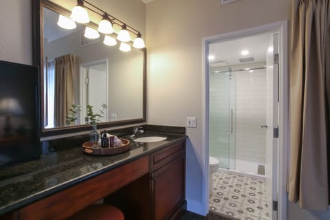 Top Floor Courtyard View King Suite Sleeper Sofa | Bathroom | Eco-friendly toiletries, hair dryer, towels