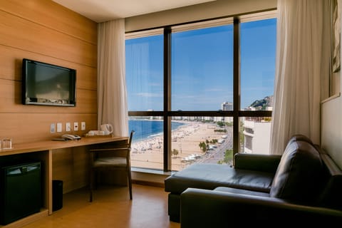 Suite, Sea View | Minibar, in-room safe, desk, laptop workspace