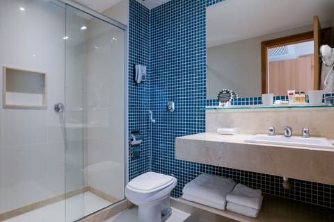 Suite, Sea View | Bathroom | Shower, rainfall showerhead, hair dryer, towels