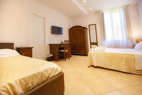 Standard Triple Room | 9 bedrooms, down comforters, Select Comfort beds, minibar