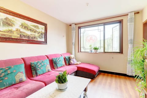 Three-Bedroom Apartment | Living area | Flat-screen TV