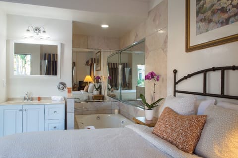 Romantic Suite, 1 Queen Bed, Jetted Tub, Ground Floor (Spa) | Desk, laptop workspace, blackout drapes, iron/ironing board