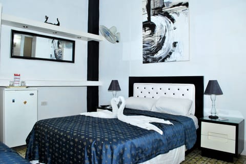 Economy Triple Room, Multiple Beds, Non Smoking | Premium bedding, down comforters, minibar, in-room safe